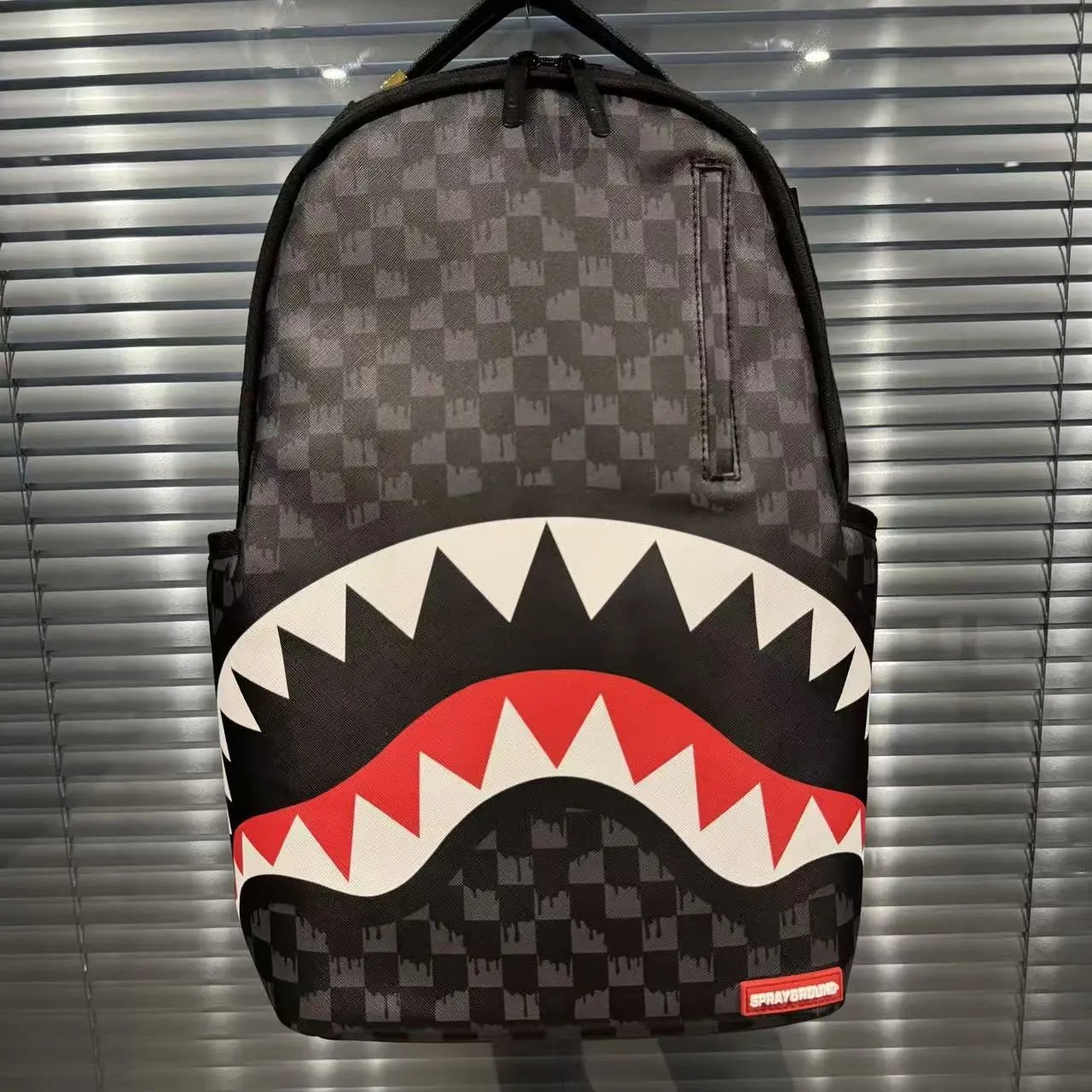 Black backpack with graphic front panel