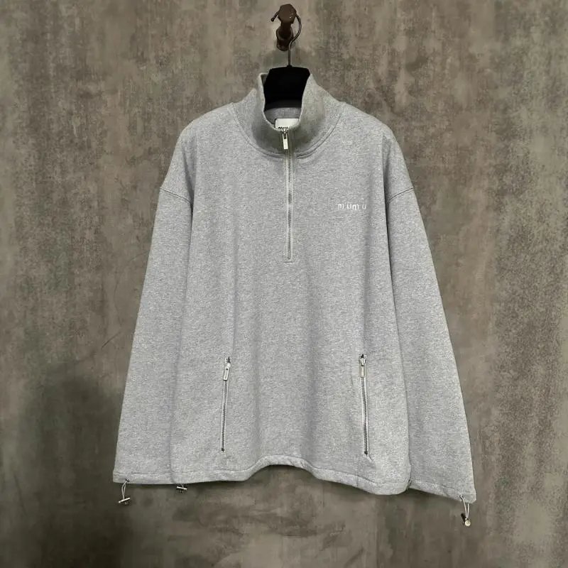 Grey quarter-zip pullover with drawcord hem