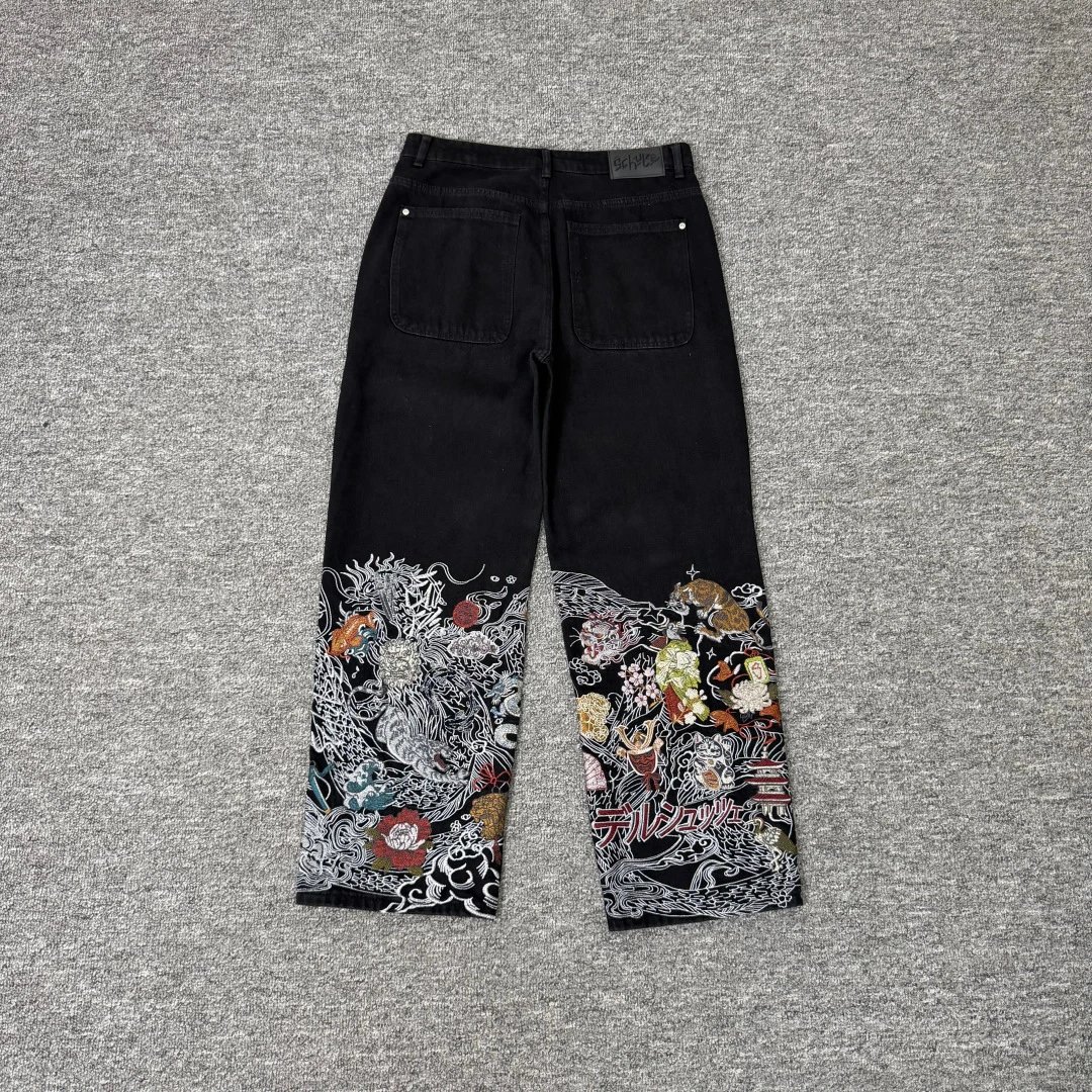 Black embroidered denim trousers, rear view