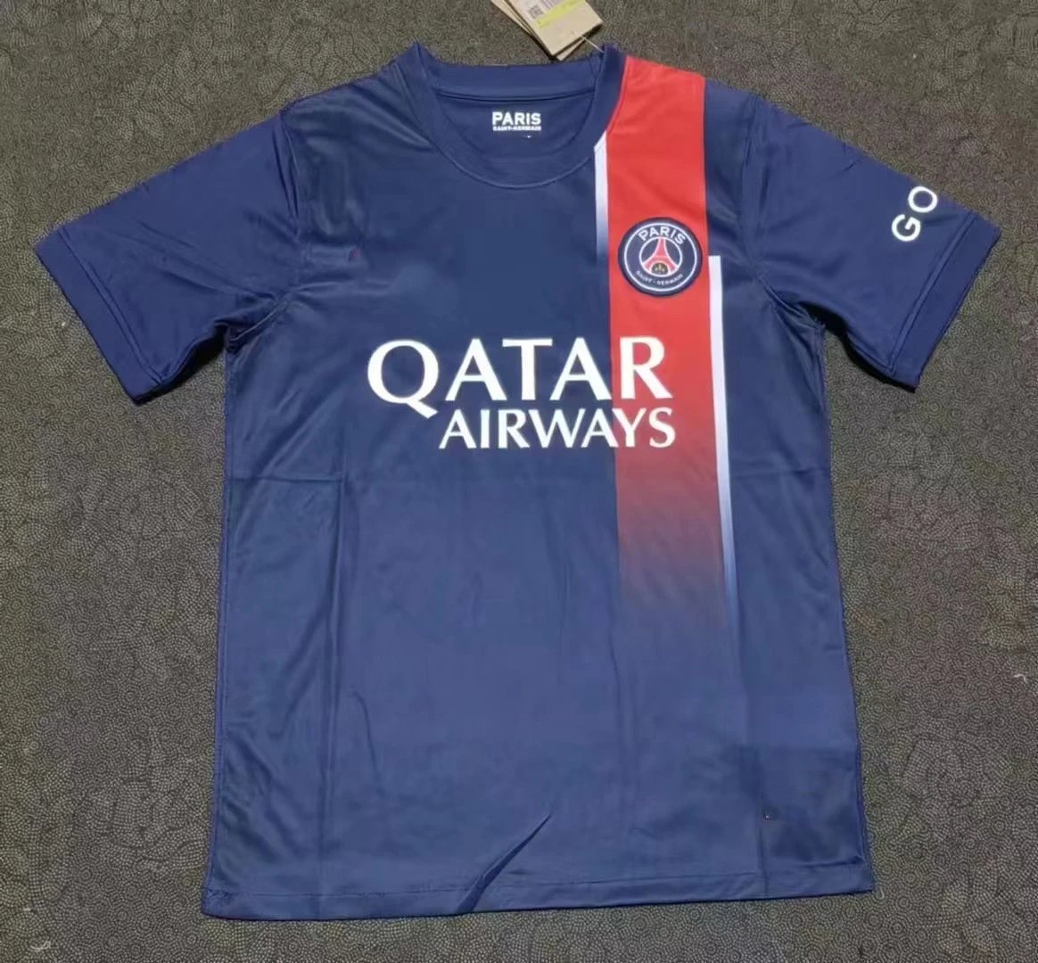 Navy and red football shirt laid flat